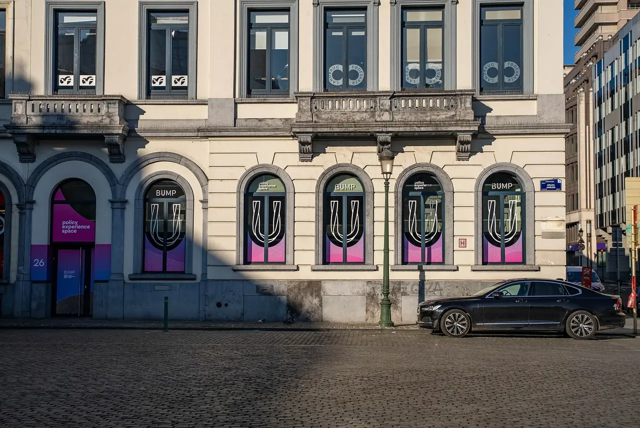The Bump Policy Experience Space on Place du Luxembourg — Bump-branded arched windows along the ground floor